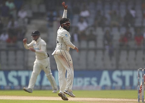 New Zealand's Ajaz Patel celebrates the dismissal of India's Mayank Agarwal during the day two of their second test cricket match. (Photo | AP)