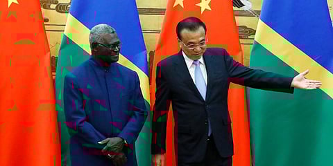 Solomon Islands Prime Minister Manasseh Sogavare, left, and Chinese Premier Li Keqiang attend a signing ceremony at the Great Hall of the People in Beijing, Wednesday, Oct. 9, 2019. (File Photo | AP)