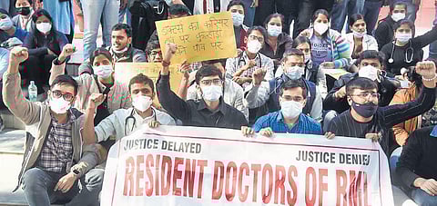 Resident doctors of Ram Manohar Lohia Hospital protest over delay in NEET-PG counselling on Monday. (Photo | Parveen Negi)