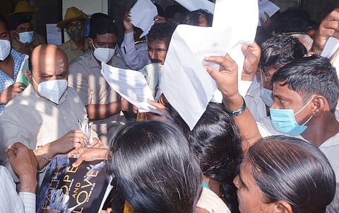 CM Basavaraj Bommai receiving public grievances in Hubballi on Tuesday. (Photo | D Hemanth)