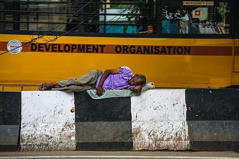 A homeless man sleeping on the sidewalk. (Representational photo | Pexels.com)
