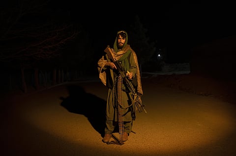 A Taliban fighter poses for a photo at a check point in Herat Afghanistan, on Monday, Nov. 29, 2021. (Photo | AP)