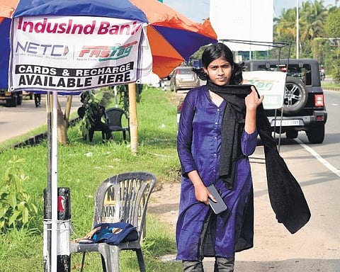 Shehreen Aman selling FASTags near Kumbalam Toll Plaza on the National Highway 66 | Albin Mathew