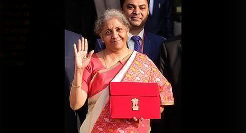 Finance Minister Nirmala Sitharaman holds a folder case containing the Union Budget 2021-22 in Delhi. (Photo | Shekhar Yadav, EPS)