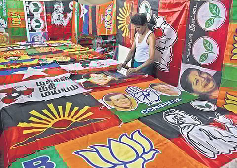 A worker displaying flags at his shop in Coimbatore city. Around 100 workers, mostly women tailors, are involved in flag-making in the city | U Rakesh kumar