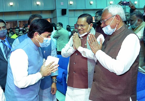 Syed Shahnawaz Hussain greeting CM Nitish Kumar after taking over as industries minister (Photo | Twitter)
