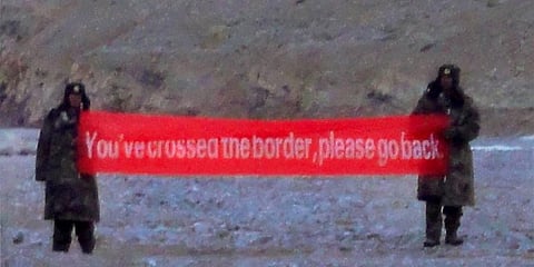 Chinese troops with a banner asking Indian soldiers to GO BACK in Daulat Beg Oldi sector of Ladakh. (File Photo | PTI)