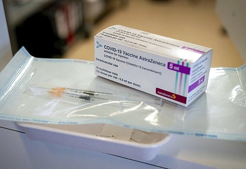 Syringes and a package with the vaccine from AstraZeneca. (Photo | AP)