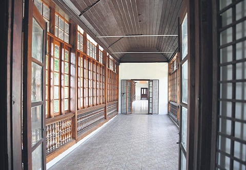 A closed balcony at the Hill Palace Museum overlooking the gardens and connecting the display halls | Albin Mathew