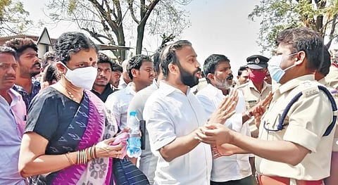 Sarpanch candidates and their followers argue with police in Tummalapalli panchayat of Kadapa district on Wednesday. (Photo | EPS)