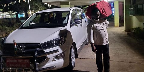 A VRO seen carrying files at the Tahsildar office in Mahabubabad on Wednesday. (Photo| EPS)