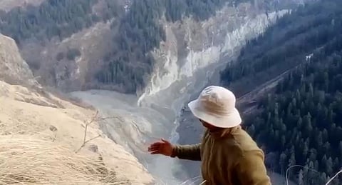 Geologist Naresh Rana points to the site of lake formation.