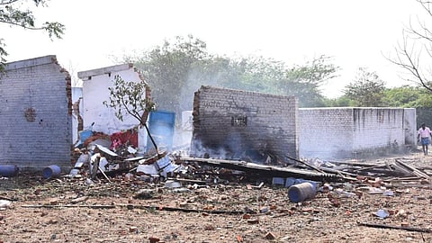 A view of the working sheds seen damaged following the blast that was triggered at a cracker unit at Achankulam village near Sattur in Virudhunagar district.