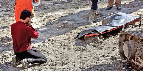 A relative of one of the victims of the Chamoli tragedy breaks down in front of his body near the Tapovan site. (Photo | EPS/ Shekhar yadav)