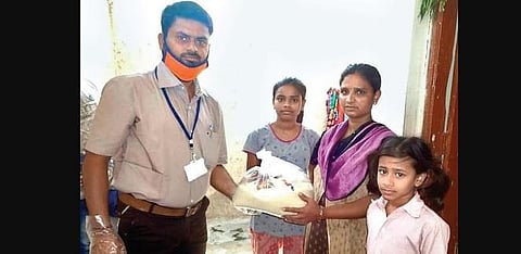 Mude Ravi Naik distributes essential commodities to the poor in Anantapur. | Express