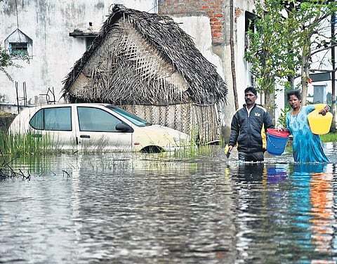 File picture of Jawahar Nagar residents in Chennai wading through knee-deep water following Cyclone Nivar