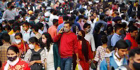 People walk in a market to shop ahead of the Diwalli festival in New Delhi. (Photo | AP)