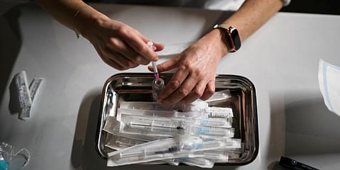 A nurse prepares doses of the Moderna COVID-19 vaccine at a vaccination center in Le Cannet, southern France. (Photo | AP)
