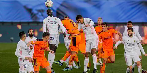 Real Madrid's Ferland Mendy heads the ball during the Spanish La Liga soccer match against Valencia at the Alfredo Di Stefano stadium in Madrid. (Photo | AP)