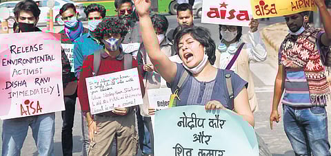 AISA members protest demanding the release of activists Nodeep Kaur, Shiv Kumar and Disha Ravi in New Delhi. (Photo | Shekhar Yadav, EPS)