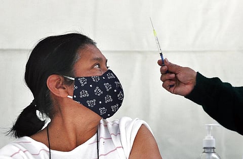 A person prepares to get a shot of the AstraZeneca vaccine against COVID-19 in the Magdalena Contreras area of Mexico City. (Photo | AP)