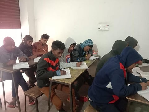 Ashish Kumar (in black jacket in second row) during the exam. (Photo | Express)