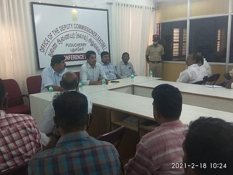 Deputy Commissioner Excise T Sudhakar holding a meeting with liquor shop licensees on Thursday (Photo | Special arrangement)
