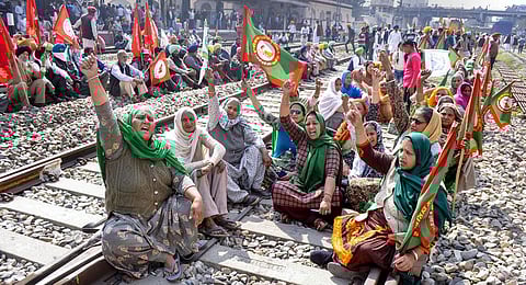 Members of various farmer organisations block a railway track during a four-hour 'rail roko' as part of their agitation against Centre's farm reform laws, in Patiala. (Photo | PTI)
