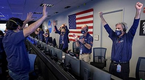 This NASA photo shows members of NASA’s Perseverance rover team as they react in mission control after receiving confirmation the spacecraft successfully touched down on Mars| AFP