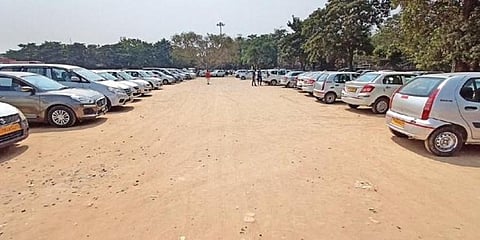 Ola and Uber cabs parked on the ground, in view of the protest staged by drivers demanding hike in base fare, in Hyderabad on Thursday. (Photo | RVK Rao, EPS)