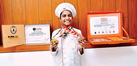 Hayan Abdulla with certificates and medals of Asia Book of Records and India Book of Records