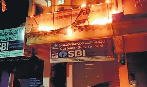 TRS activists burnt the BJP office board in Parkal on Monday.