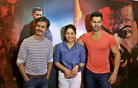 Bollywood actors Nawazuddin Siddiqui along with Yami Gautam and Varun Dhawan at a promotional event of 'Badlapur' in Bengaluru. (File | PTI)