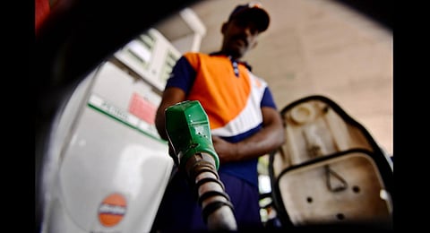 A filling station attendant fills petrol into a scooter in Chennai. (Photo | Debadatta Mallick, EPS)