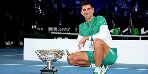 Serbia's Novak Djokovic poses with the Norman Brookes Challenge Cup after defeating Russia's Daniil Medvedev in the men's singles final at the Australian Open (Photo| AP)