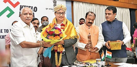 Chief Minister B S Yediyurappa honouring Union Sports Minister Kiren Rijiju during a meeting on Khelo India University Games, in Bengaluru on Sunday