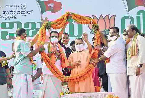 Uttar Pradesh Chief Minister Yogi Adityanath being welcomed by BJP leaders at the launch of K Surendran’s Vijaya Yatra in Kasaragod on Sunday | Express