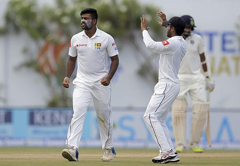 Sri Lanka's bowler Lahiru Kumara, left, celebrates taking a wicket. (File photo | AP)