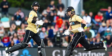 New Zealand's Devon Conway (L) and Glenn Phillips run between the wickets during the first T20 cricket international against Australia. (Photo | AP)