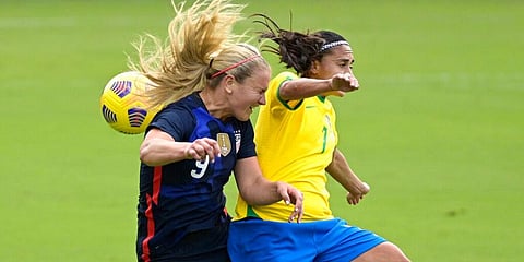 United States midfielder Lindsey Horan (9) and Brazil midfielder Andressa (7) compete for a header during the first half of a SheBelieves Cup match. (Photo | AP)