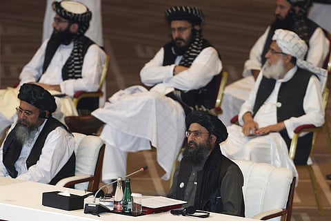 Taliban co-founder Mullah Abdul Ghani Baradar, bottom right, speaks at the opening session of peace talks between the Afghan government and the Taliban in Doha, Qatar. (File Photo)
