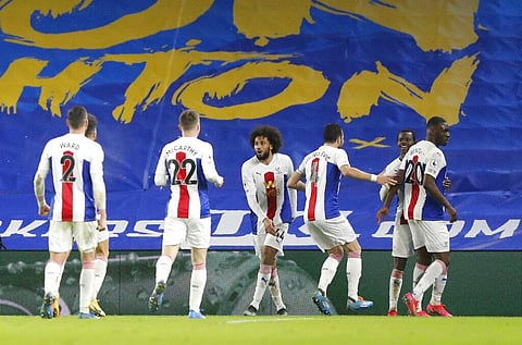 Crystal Palace players celebrate after Christian Benteke, right, scored his side's second goal during the match against Brighton at the Falmer stadium in Brighton, England, Monday. (Photo | AP)