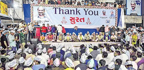 Aam Aadmi Party candidates and workers celebrate after winning multilple seats in the Surat Municipal Corporation polls. (Photo | PTI)