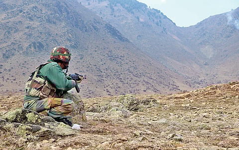 A security personnel during encounter at south Kashmir’s Sirhama. (Photo | Zahoor Punabi)