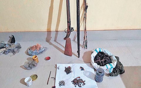 The items seized from poachers and (inset) the vehicle vandalised by poachers | Express