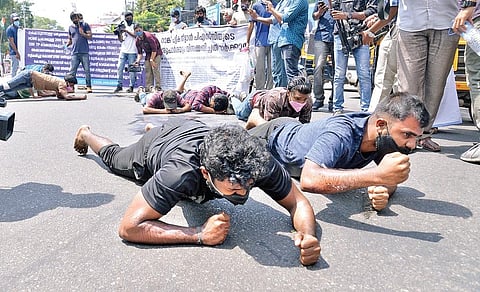 Protestors crawling on their knees in front of the Secretariat | File pic