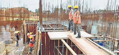 A file picture of labourers at construction site in Bengaluru | express