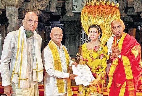 Sanjay Paasi CEO Delhi based PASCO Chairman handong over the DD of Rs 10 cr as donation to TTD to Additional EO Dharma Reddy at Ranganayakula Mandapam Friday morning.