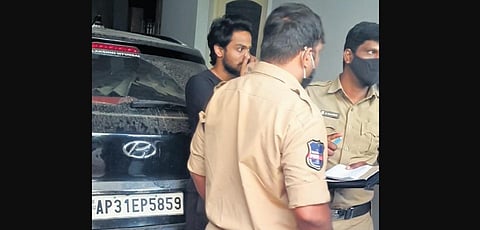 Social media star Shanmukh Jaswanth being questioned by police after crashing his car into five other vehicles at Jubilee Hills in Hyderabad on Saturday.