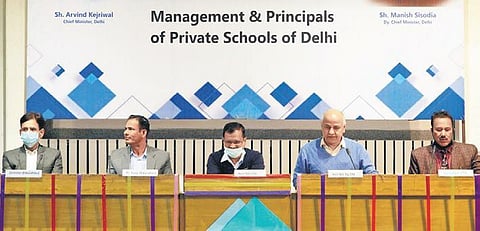 Chief Minister Arvind Kejriwal (c) interacts with principals and management authorities of private schools in Delhi. (Photo | AAP Twitter)